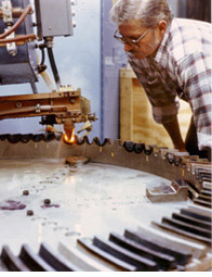 Bill Brown inspecting large gear